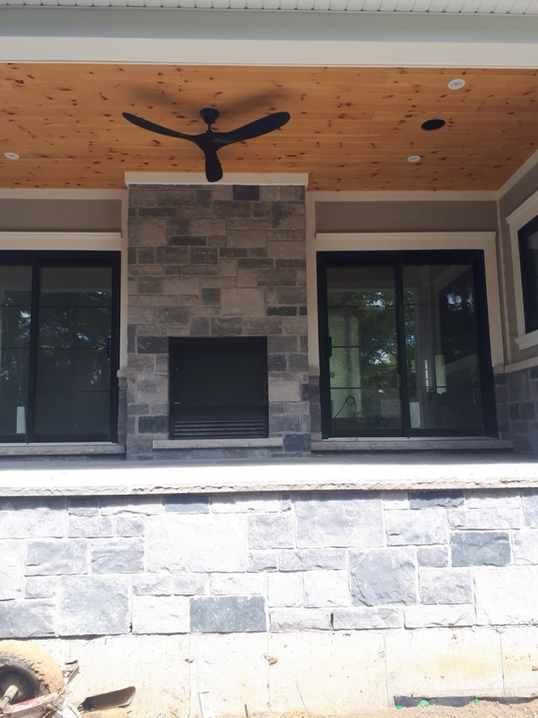 Porch fireplace with stone surround